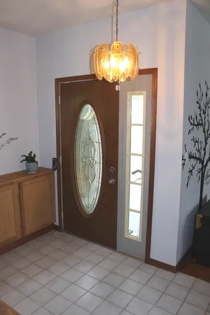 a bedroom with a bed and a lamp on table