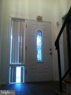 9207 Morley Road Lanham, MD 20706 - Photo 3 of 12 a view of empty room with wooden floor and fan