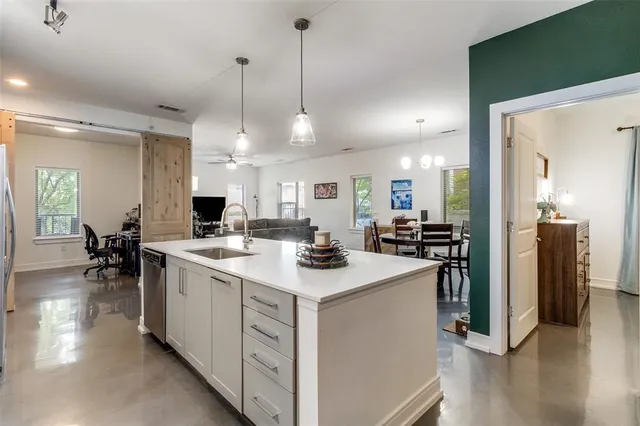 a kitchen with a sink and stove