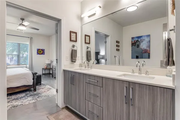 a en suite bathroom with double sink and a mirror
