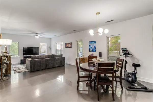 a view of a livingroom with furniture and a flat screen tv
