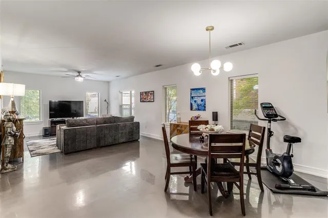 a view of a livingroom with furniture and a flat screen tv