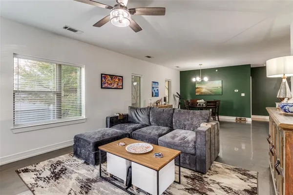 a living room with furniture and a window