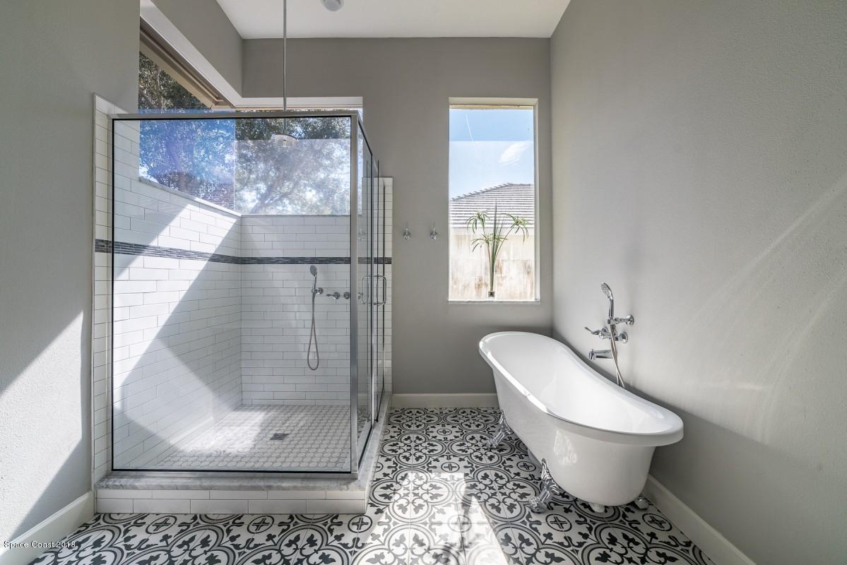 1725 Canterbury Drive Indialantic, FL 32903 - Photo 11 of 22 a bathroom with a toilet sink and shower