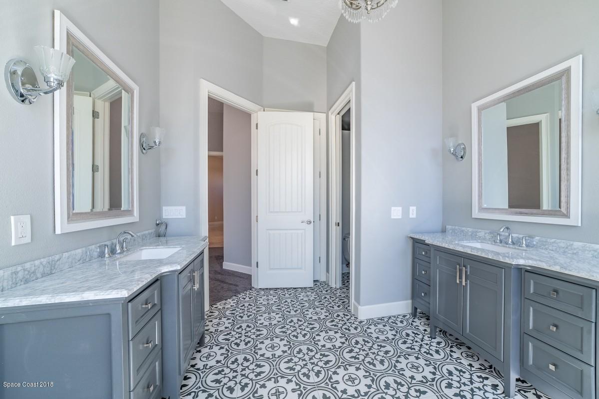 1725 Canterbury Drive Indialantic, FL 32903 - Photo 12 of 22 a bathroom with a sink and a mirror