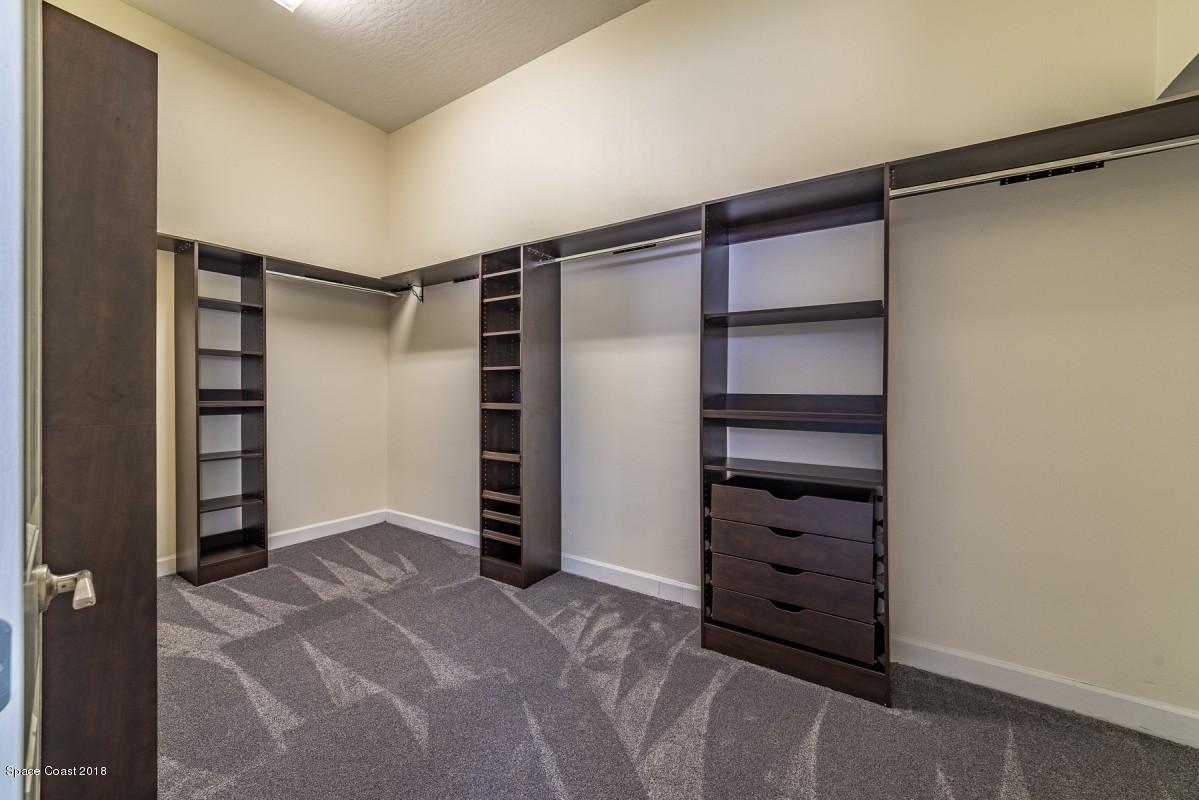 1725 Canterbury Drive Indialantic, FL 32903 - Photo 13 of 22 a view of walk in closet with empty racks