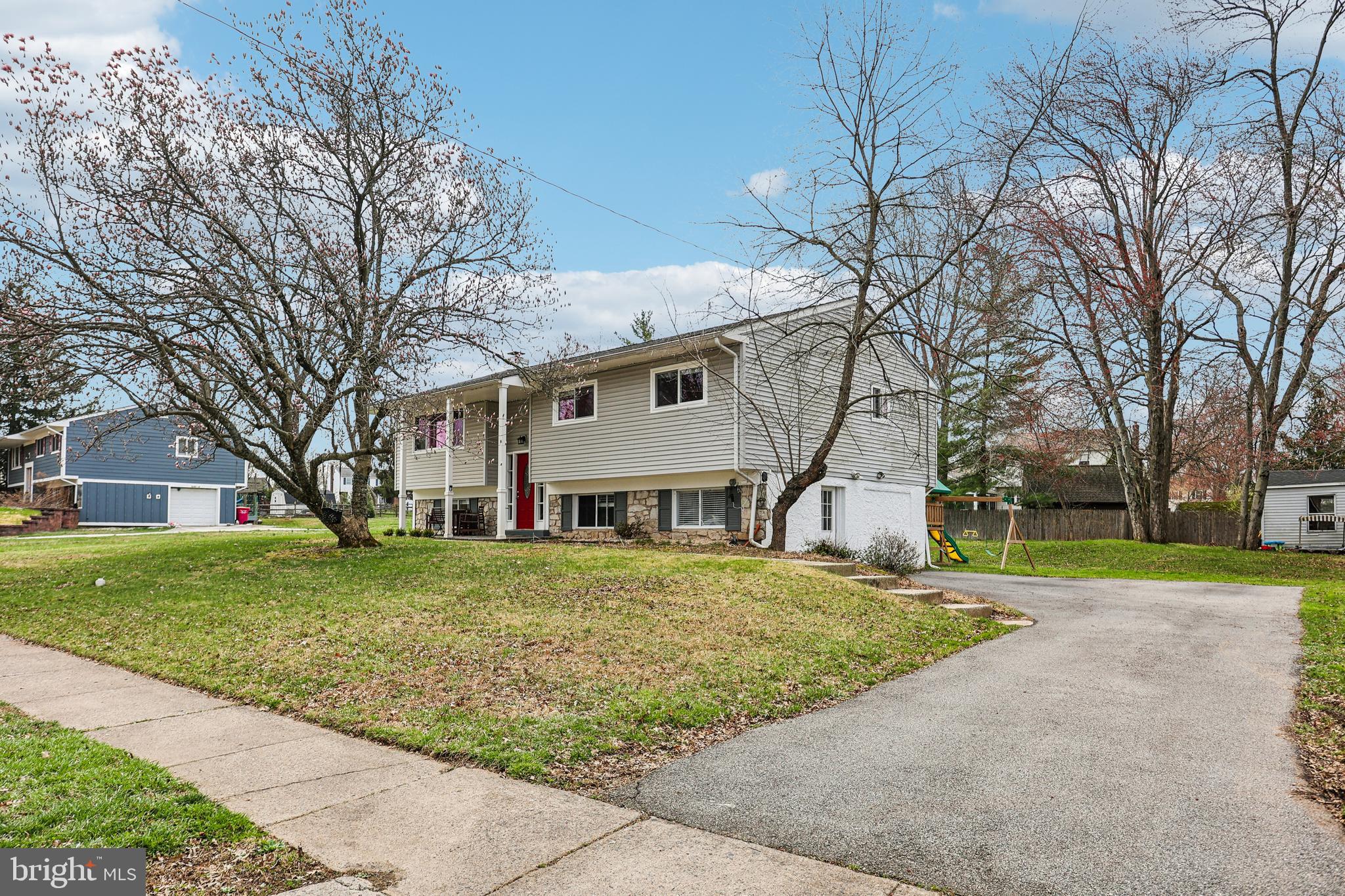 15 Brimfield Road Audubon, PA 19403 - Photo 2 of 41 a front view of a house with a yard and trees
