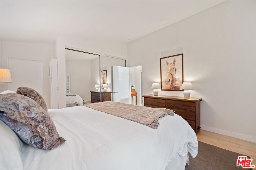 6801 Seawatch Lane Malibu, CA 90265 - Photo 11 of 34 a bedroom with a bed and a mirror