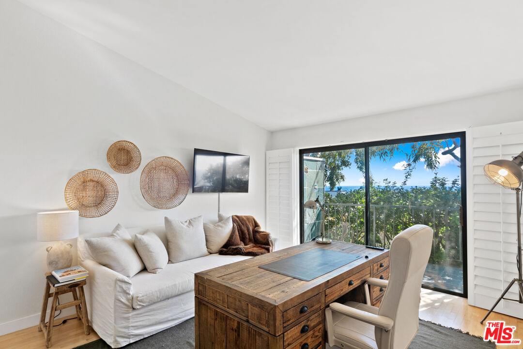 6801 Seawatch Lane Malibu, CA 90265 - Photo 15 of 34 a living room with furniture and a large window