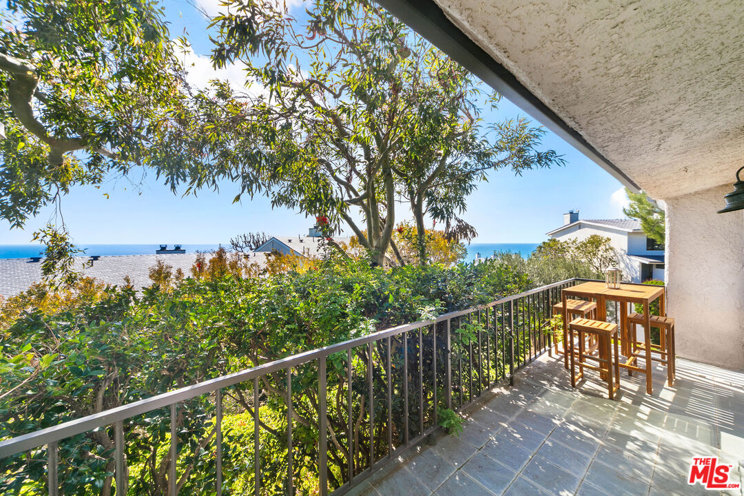 6801 Seawatch Lane Malibu, CA 90265 - Photo 17 of 34 a view of a balcony with chairs