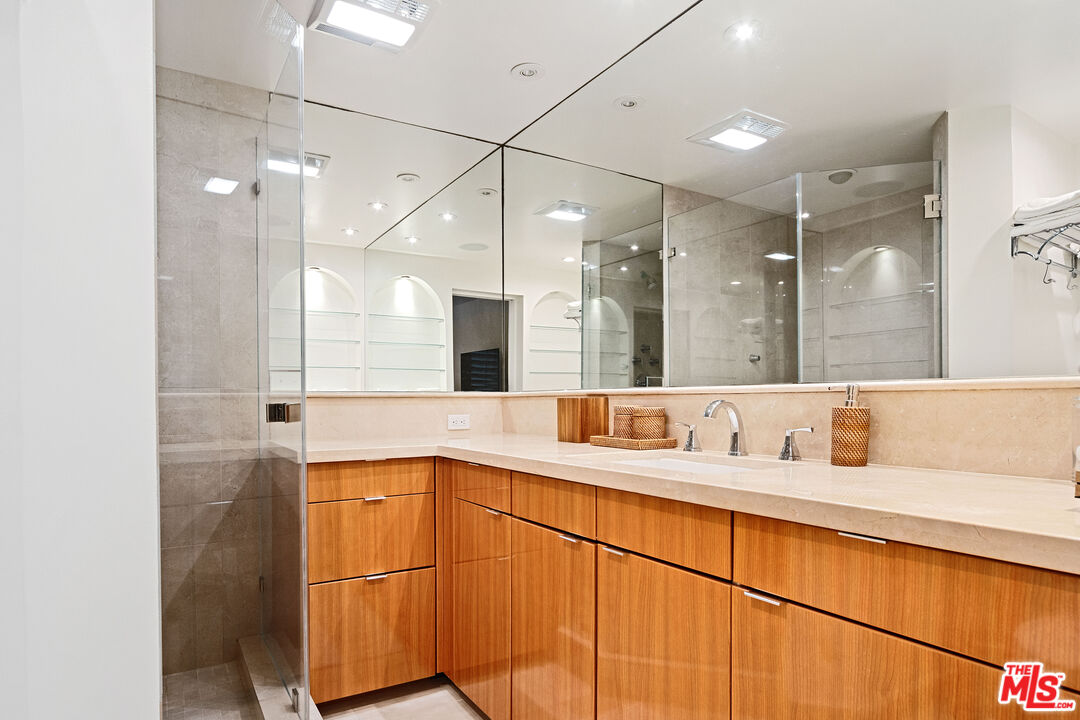 6801 Seawatch Lane Malibu, CA 90265 - Photo 22 of 34 a bathroom with a sink and a mirror