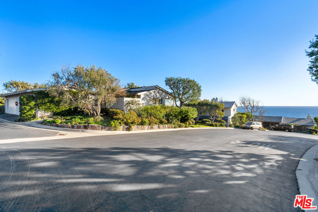 6801 Seawatch Lane Malibu, CA 90265 - Photo 27 of 34 a view of a road with a building in the background