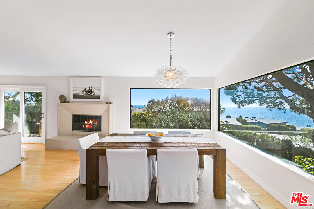 6801 Seawatch Lane Malibu, CA 90265 - Photo 5 of 34 a living room with fireplace furniture and a flat screen tv