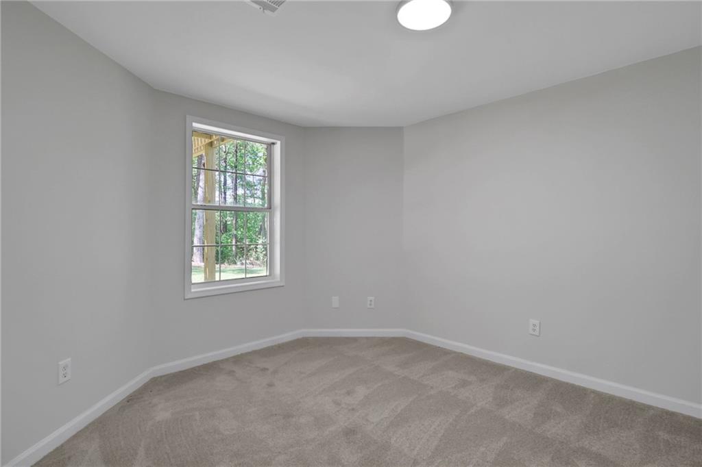 6259 Spring Lake Drive Flowery Branch, GA 30542 - Photo 20 of 35 an empty room with a window