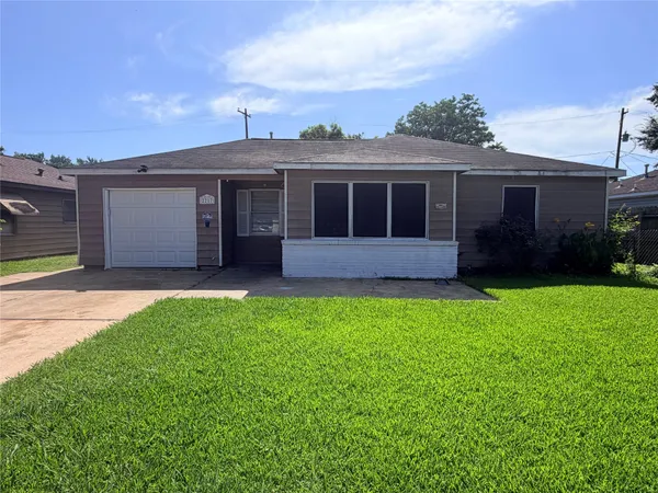 front view of a house with a garden
