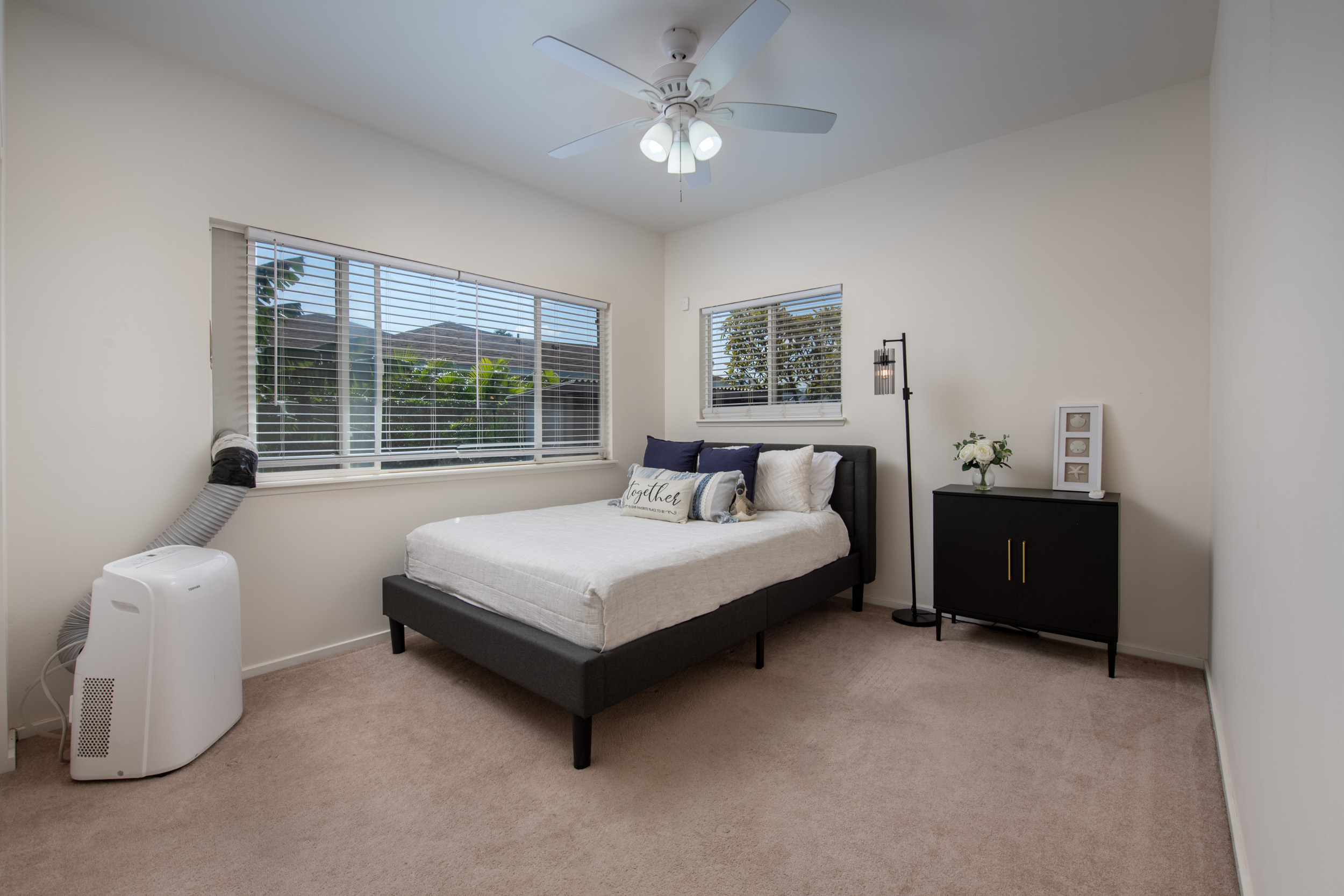 68-3559 Awamoa Place Waikoloa, HI 96738 - Photo 13 of 28 a bedroom with a bed and a couch