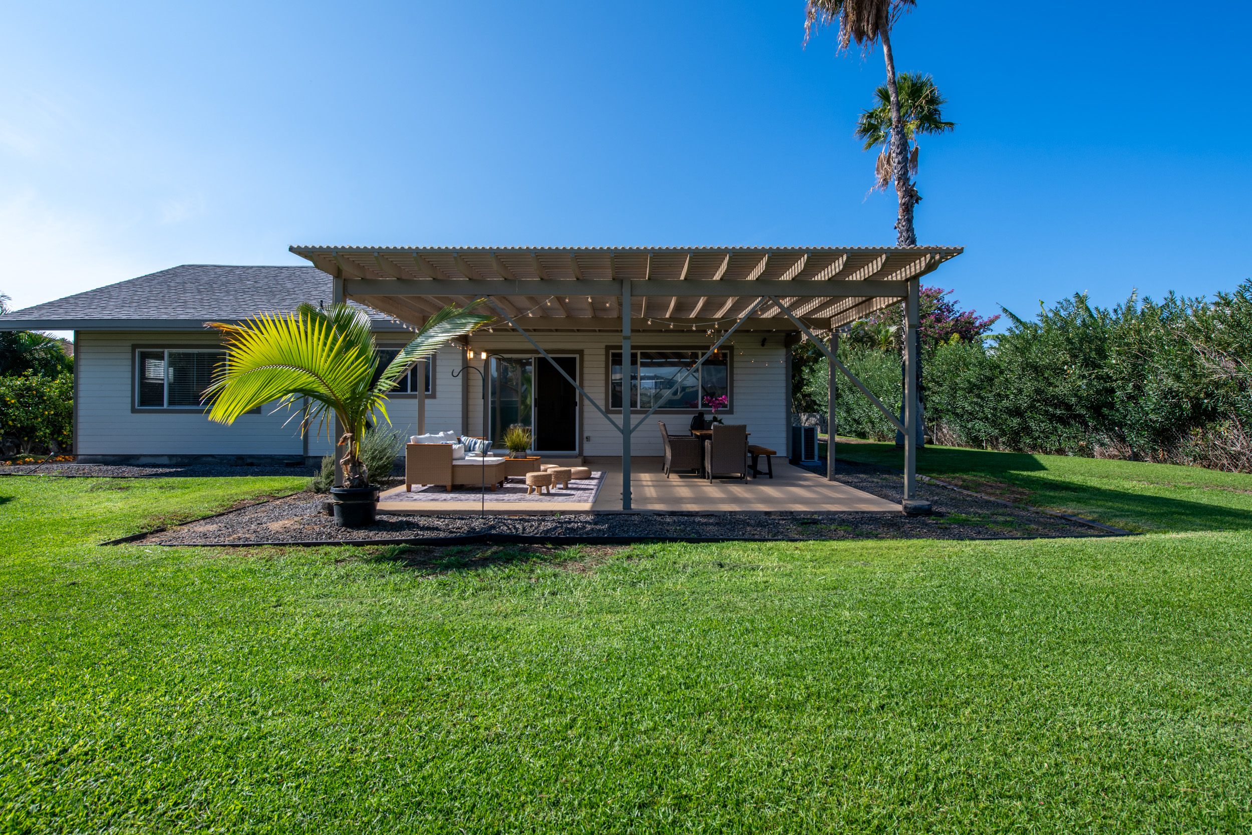 68-3559 Awamoa Place Waikoloa, HI 96738 - Photo 18 of 28 a view of a house with a backyard patio and swimming pool
