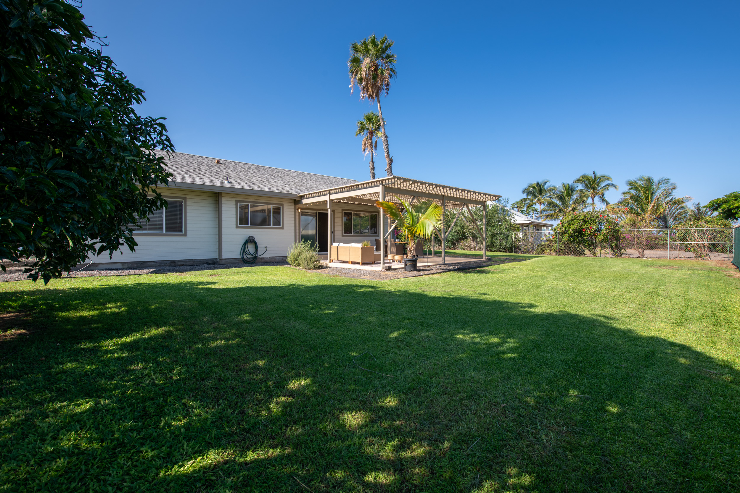 68-3559 Awamoa Place Waikoloa, HI 96738 - Photo 21 of 28 a front view of a house with a yard