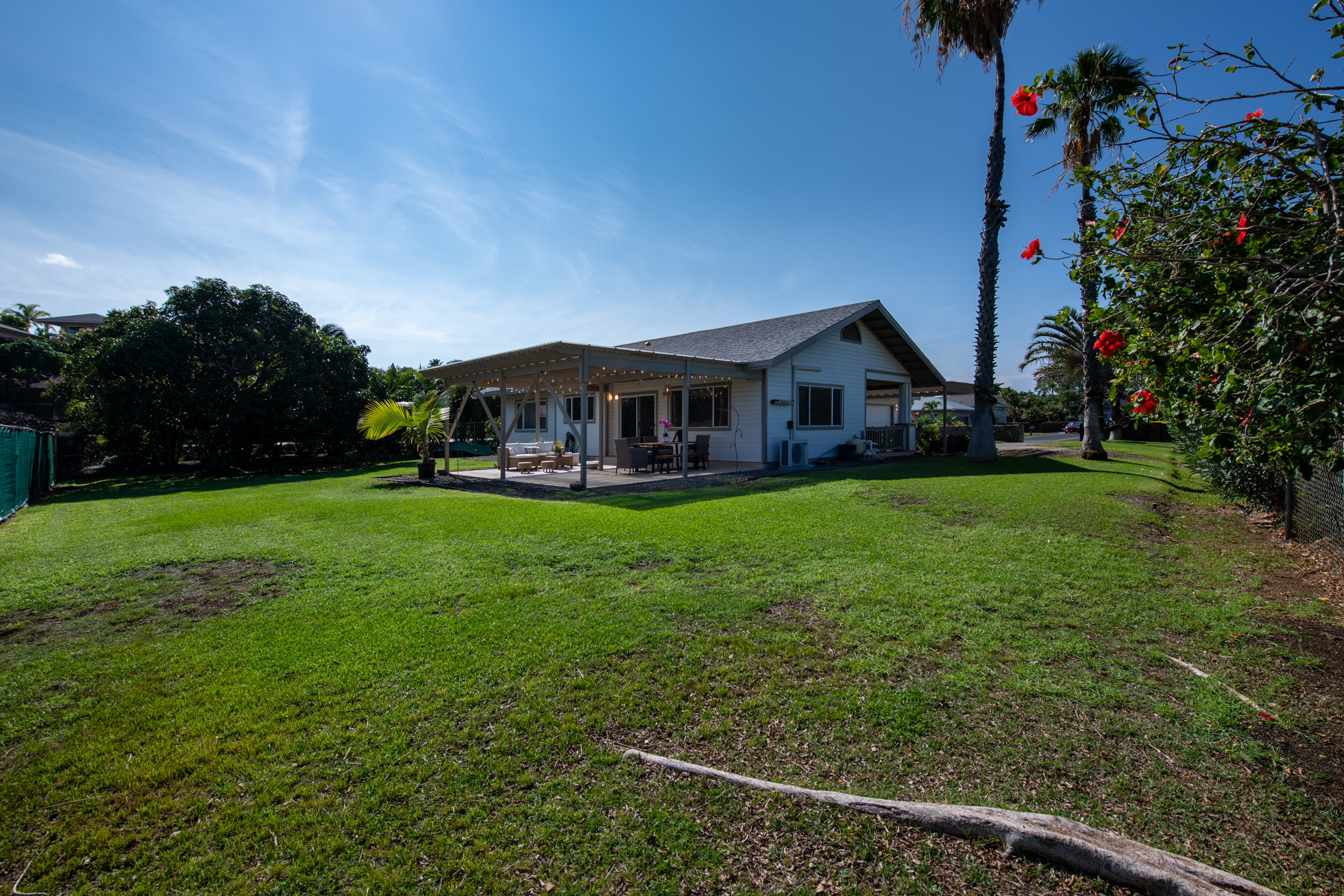 68-3559 Awamoa Place Waikoloa, HI 96738 - Photo 23 of 28 a view of house with garden and tall trees