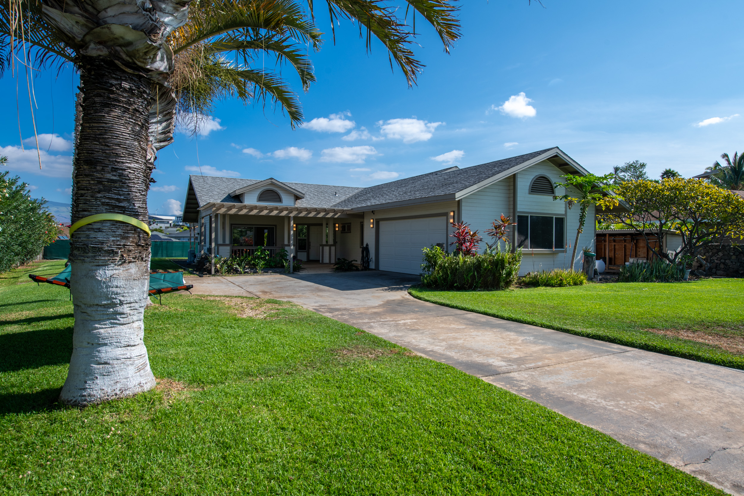 68-3559 Awamoa Place Waikoloa, HI 96738 - Photo 25 of 28 a front view of a house with garden