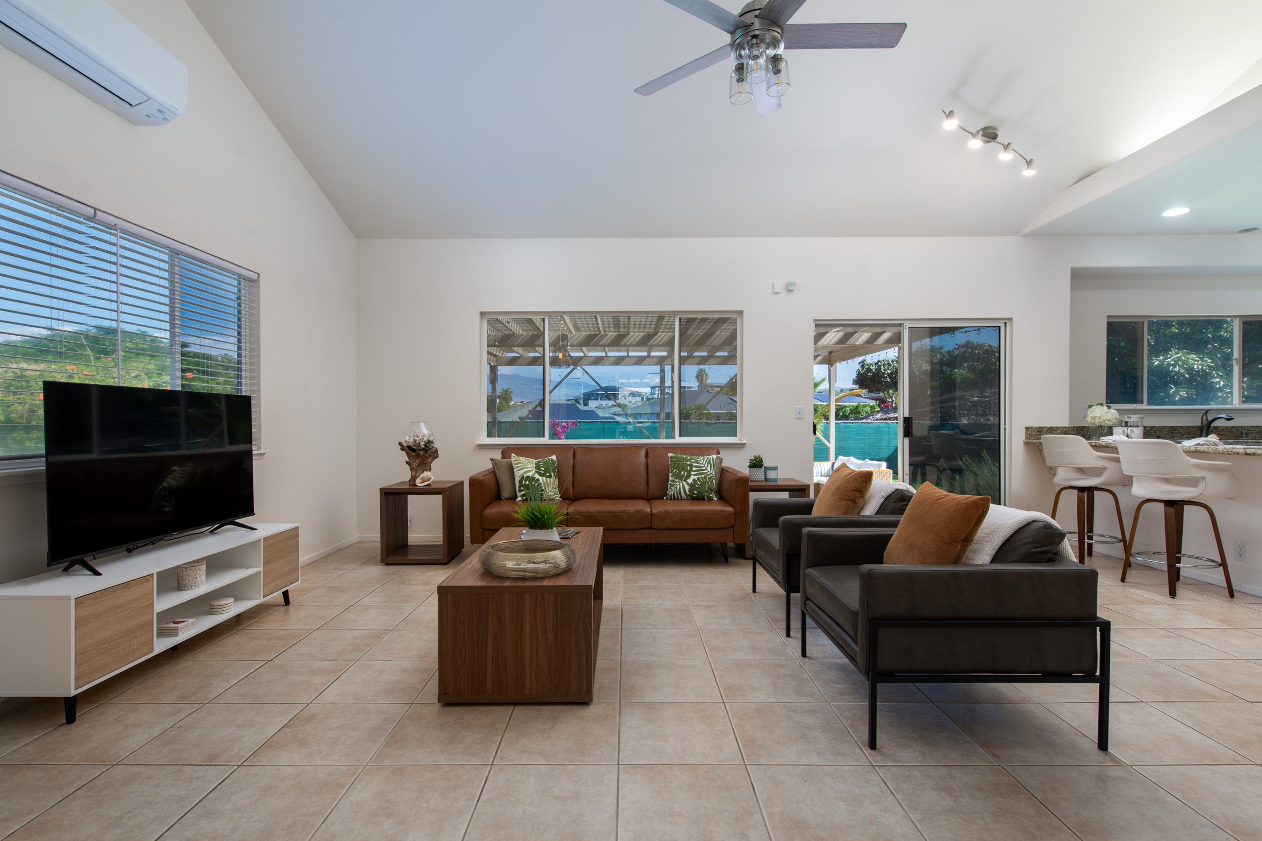 68-3559 Awamoa Place Waikoloa, HI 96738 - Photo 4 of 28 a living room with furniture and a flat screen tv