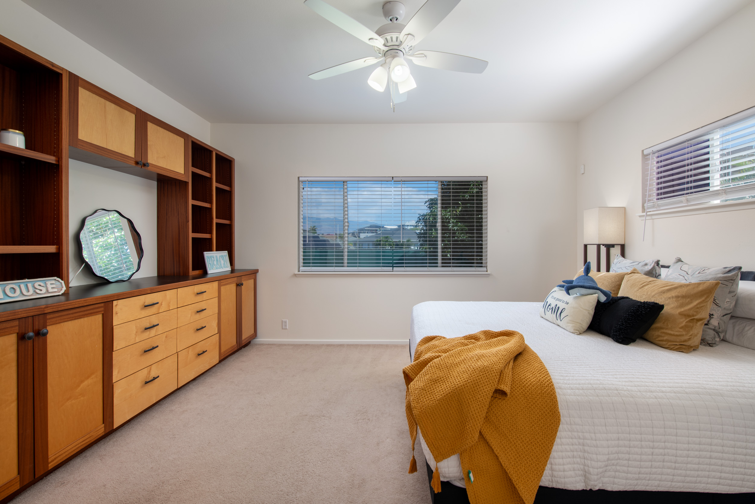 68-3559 Awamoa Place Waikoloa, HI 96738 - Photo 10 of 28 a bedroom with a bed and a chandelier