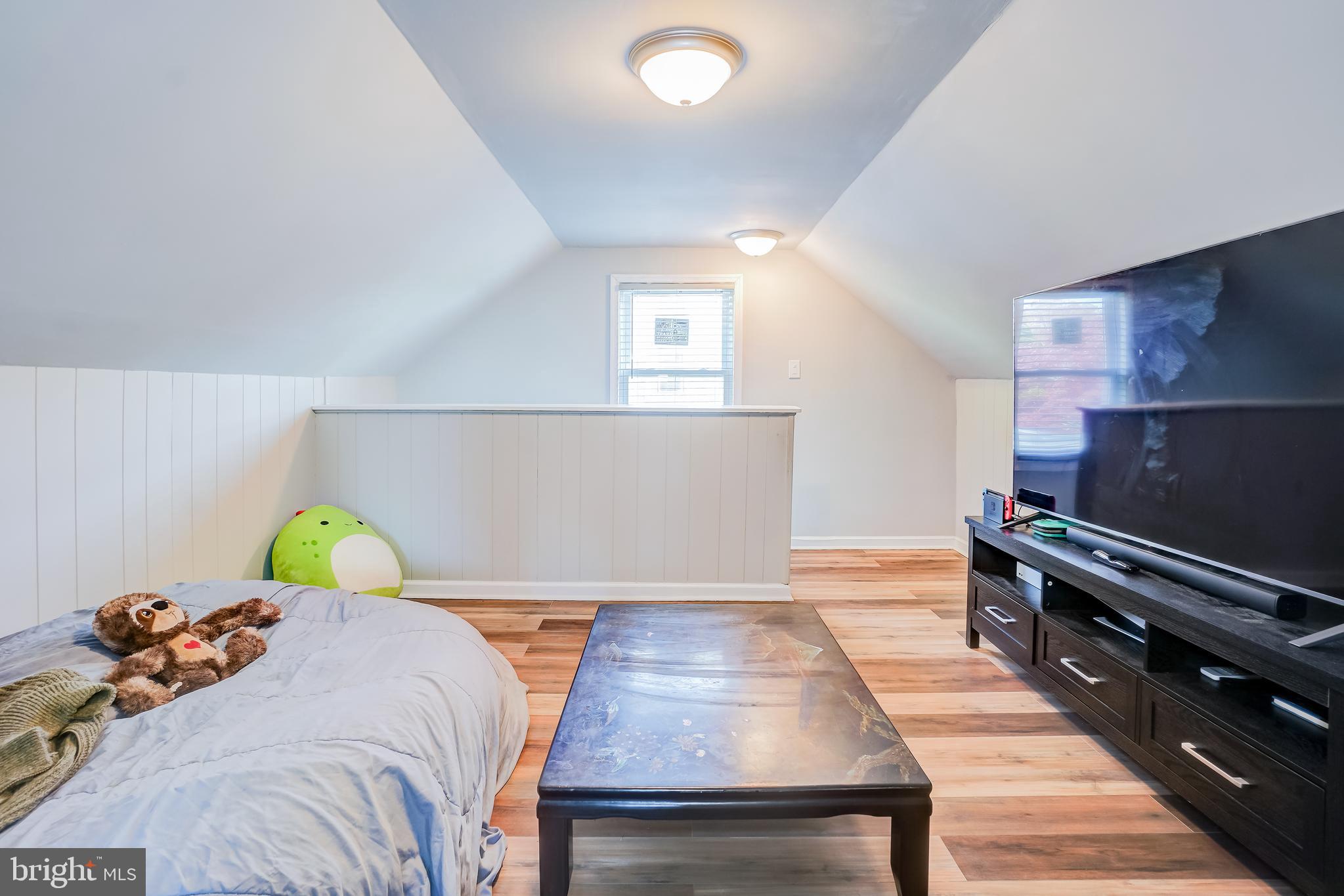 8 Avenal Road Essex, MD 21221 - Photo 11 of 17 a bedroom with a bed and wooden floor