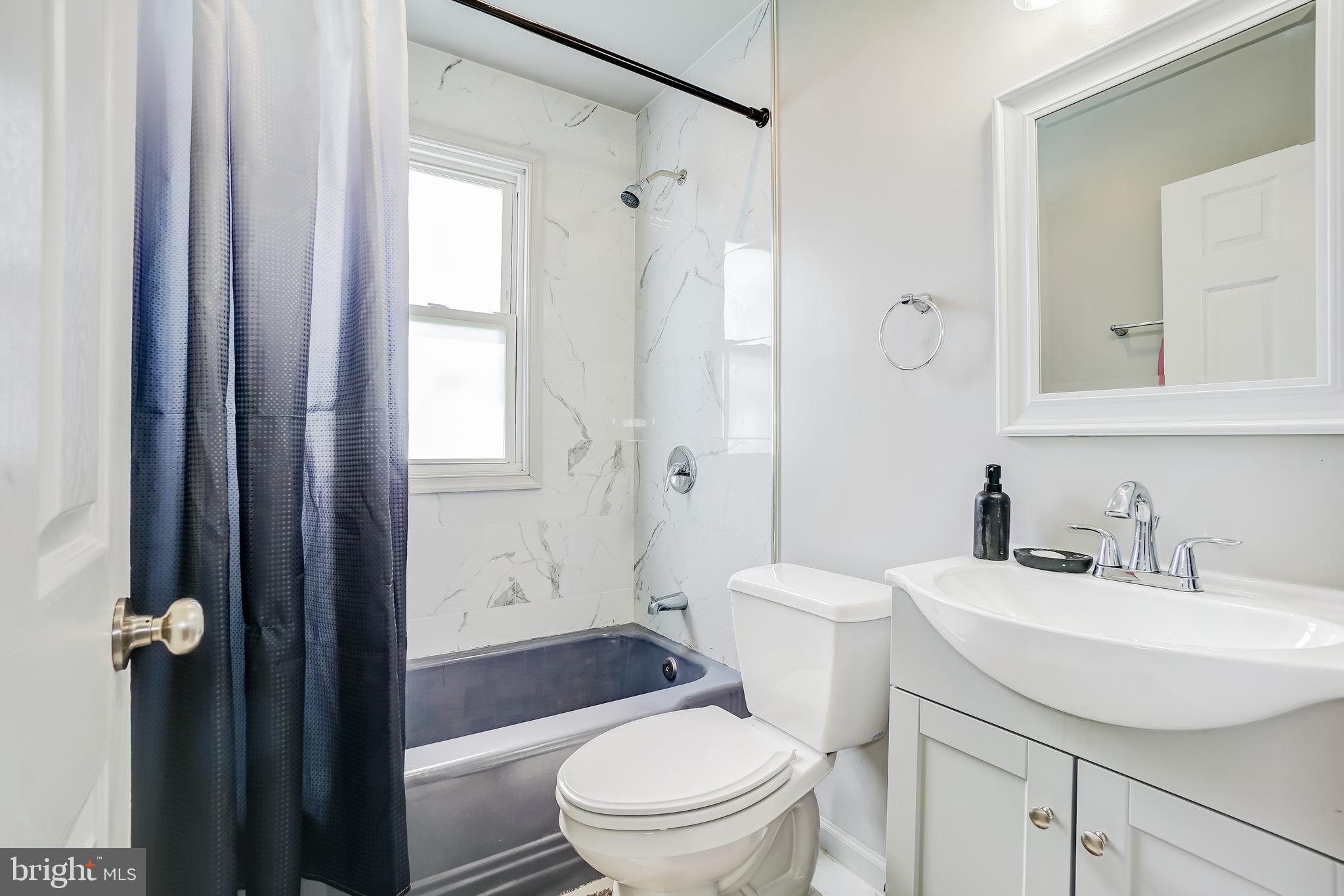 8 Avenal Road Essex, MD 21221 - Photo 13 of 17 a bathroom with a sink toilet and shower
