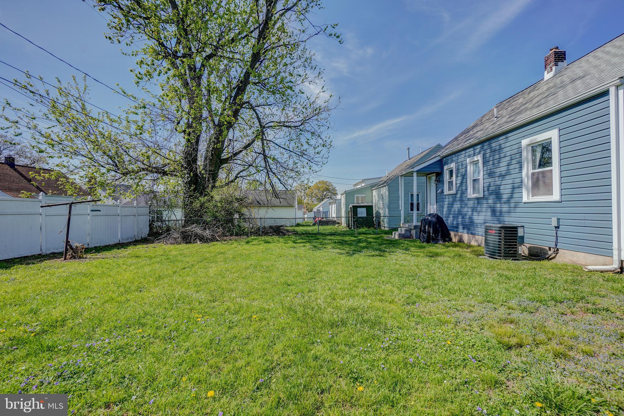 8 Avenal Road Essex, MD 21221 - Photo 14 of 17 a view of a house with a back yard