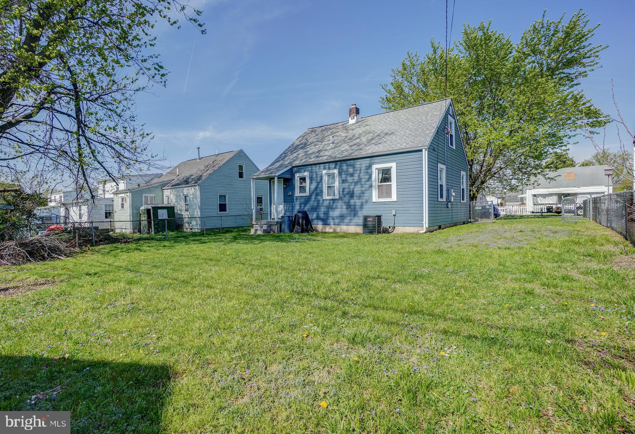 8 Avenal Road Essex, MD 21221 - Photo 15 of 17 a view of a yard in front of a house with large tree