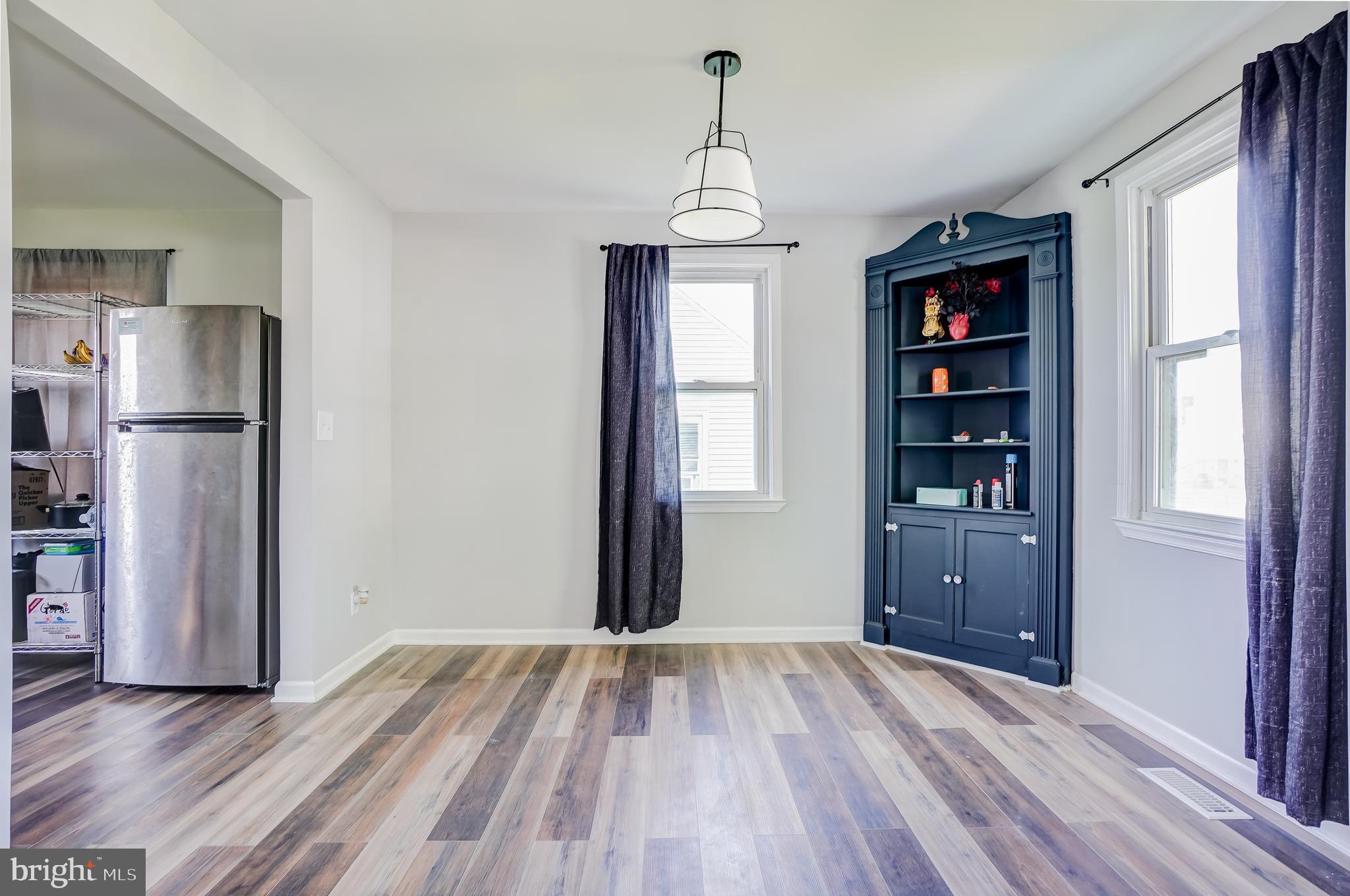 8 Avenal Road Essex, MD 21221 - Photo 6 of 17 a view of hallway with wooden floor and a window