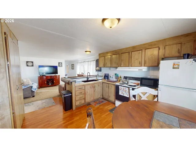 a kitchen with a refrigerator and a sink