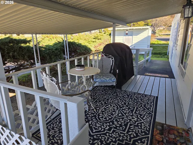 a view of balcony with furniture and wooden deck