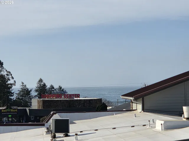 a terrace with outdoor seating and kitchen view