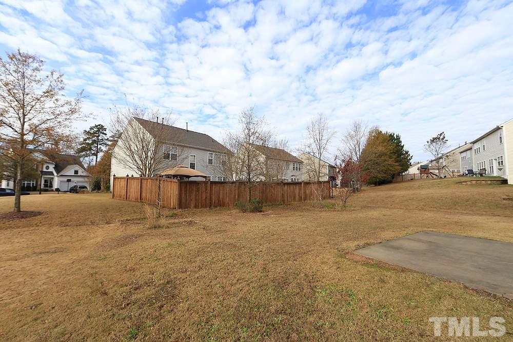 7729 San Gabriel Street Raleigh, NC 27613 - Photo 22 of 24 a view of big yard with palm trees