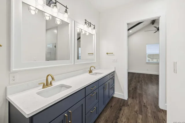 a bathroom with a sink and a mirror