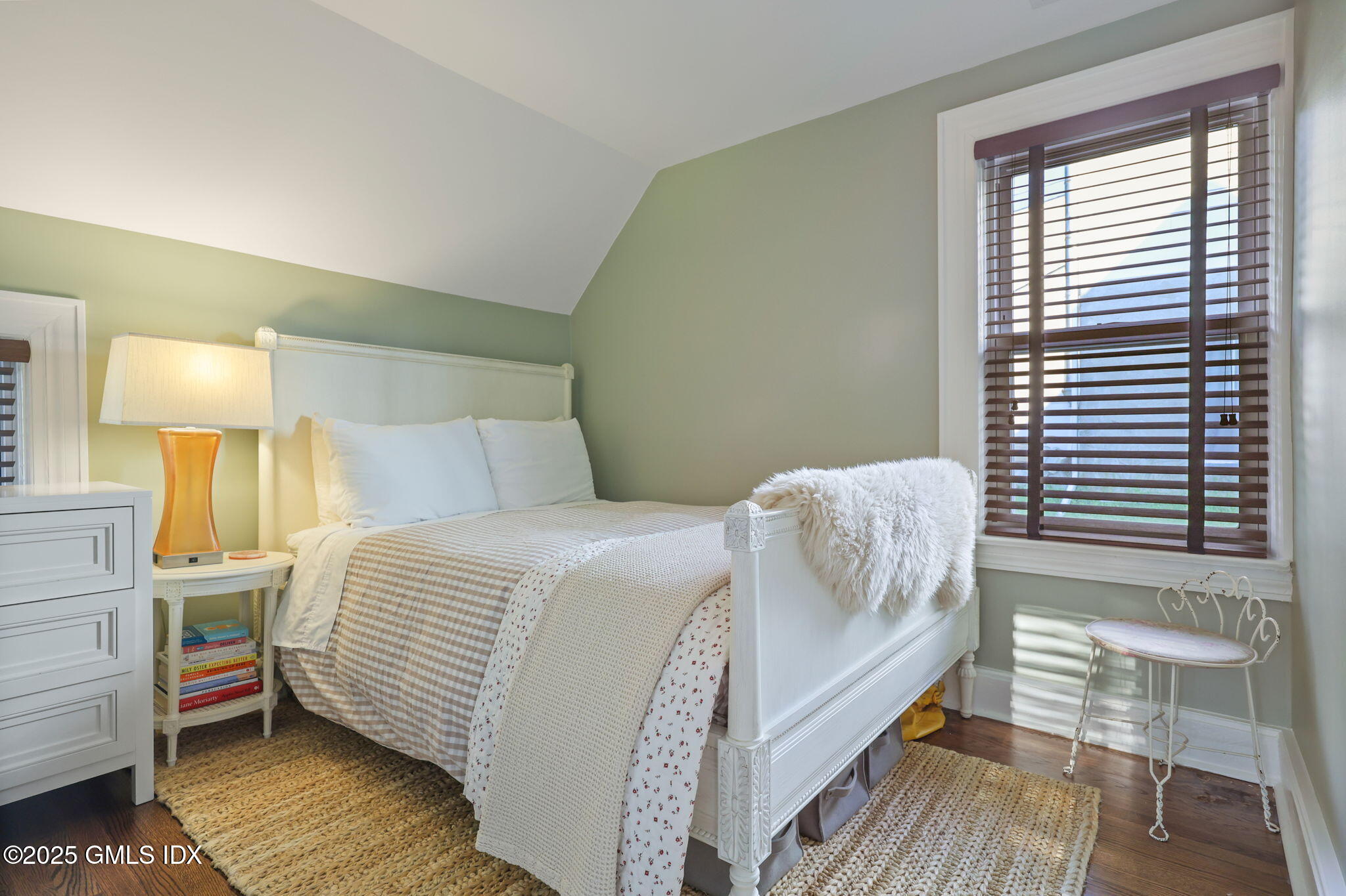 9 Cottage Place Greenwich, CT 06830 - Photo 13 of 21 a bedroom with a bed and wooden floor