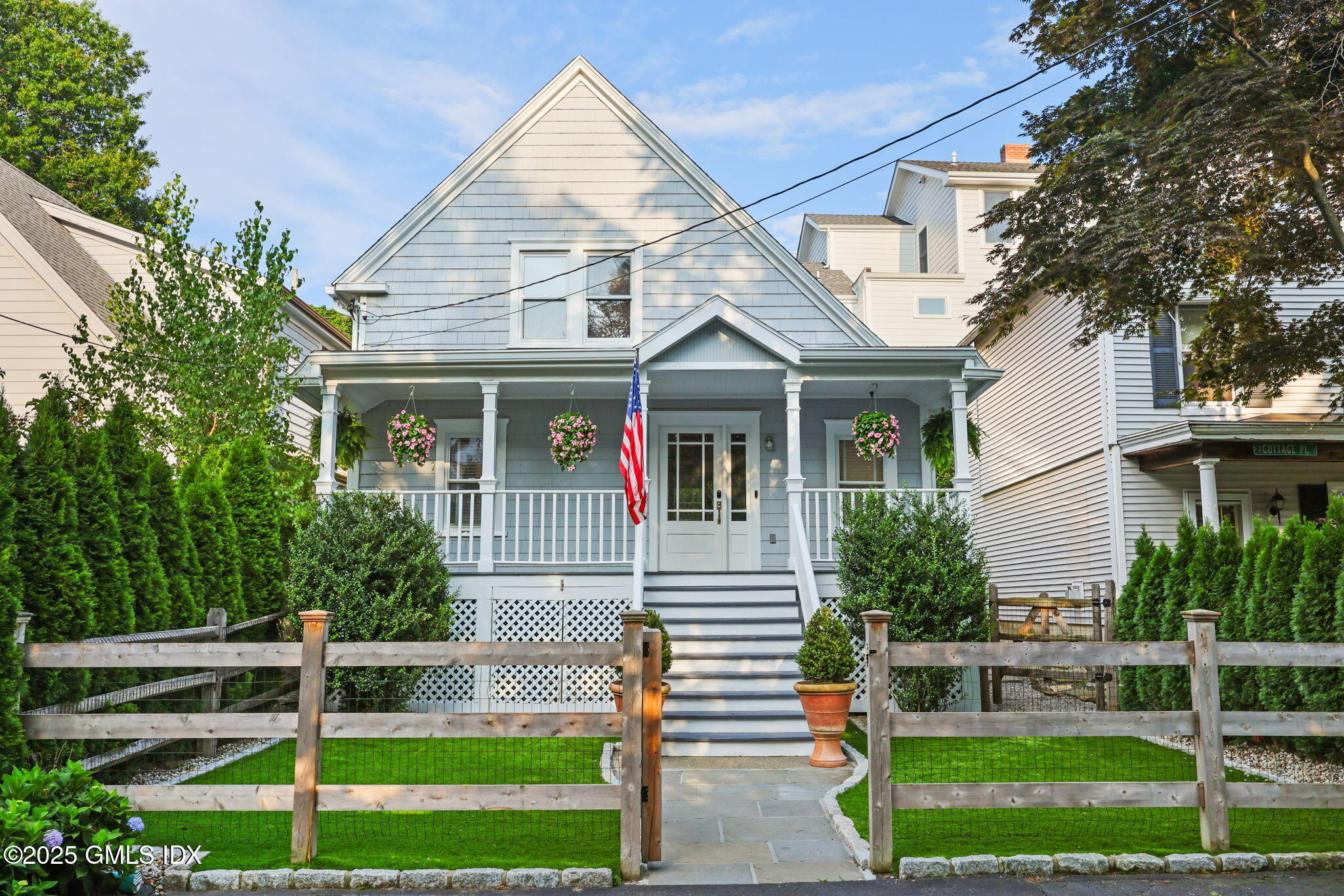 9 Cottage Place Greenwich, CT 06830 - Photo 18 of 21 a front view of a house with a yard