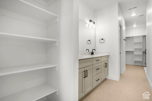 1631 West Century Lane, Unit B Mapleton, UT 84664 - Photo 19 of 33 Full bath with double vanity, a spacious closet, and light tile patterned flooring