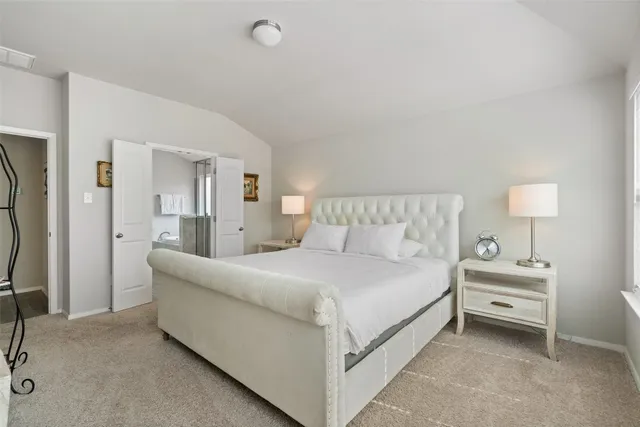 a large white bed in a white room