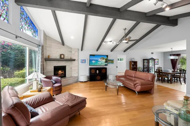 a view of backyard of house with green space