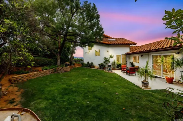 a kitchen with a sink and a stove top oven