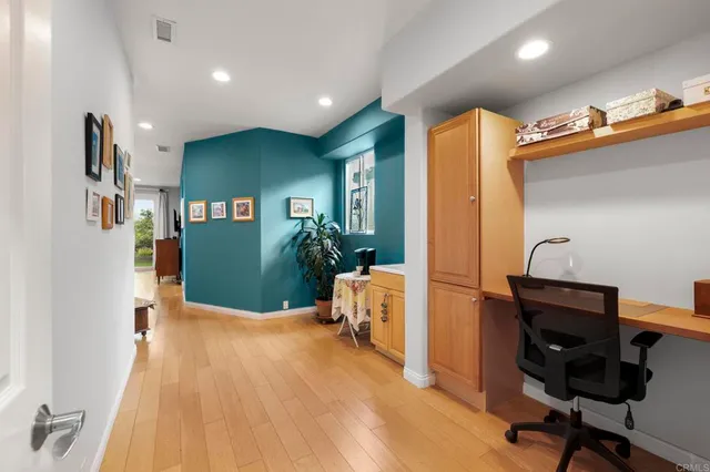 a living room with furniture a flat screen tv and a large window
