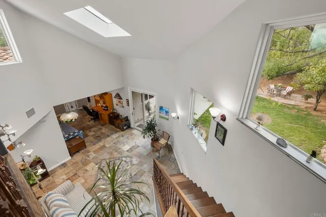 an aerial view of a house with a yard and garden