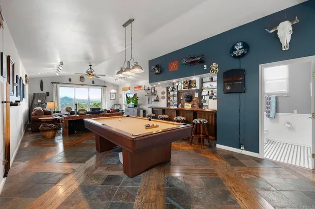 an aerial view of a house with a yard and potted plants
