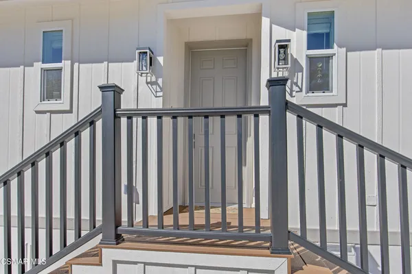 a view of entryway with wooden floor
