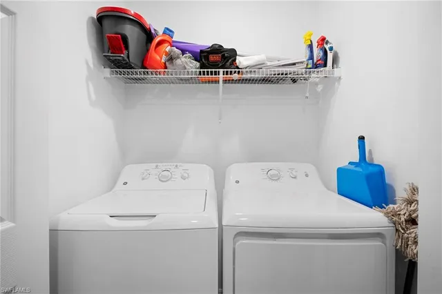 a utility room with dryer and washer