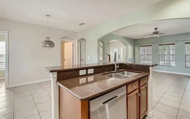 a kitchen with a sink and cabinets