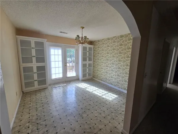 en empty room with windows