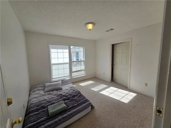 a view of a livingroom with furniture and a ceiling fan